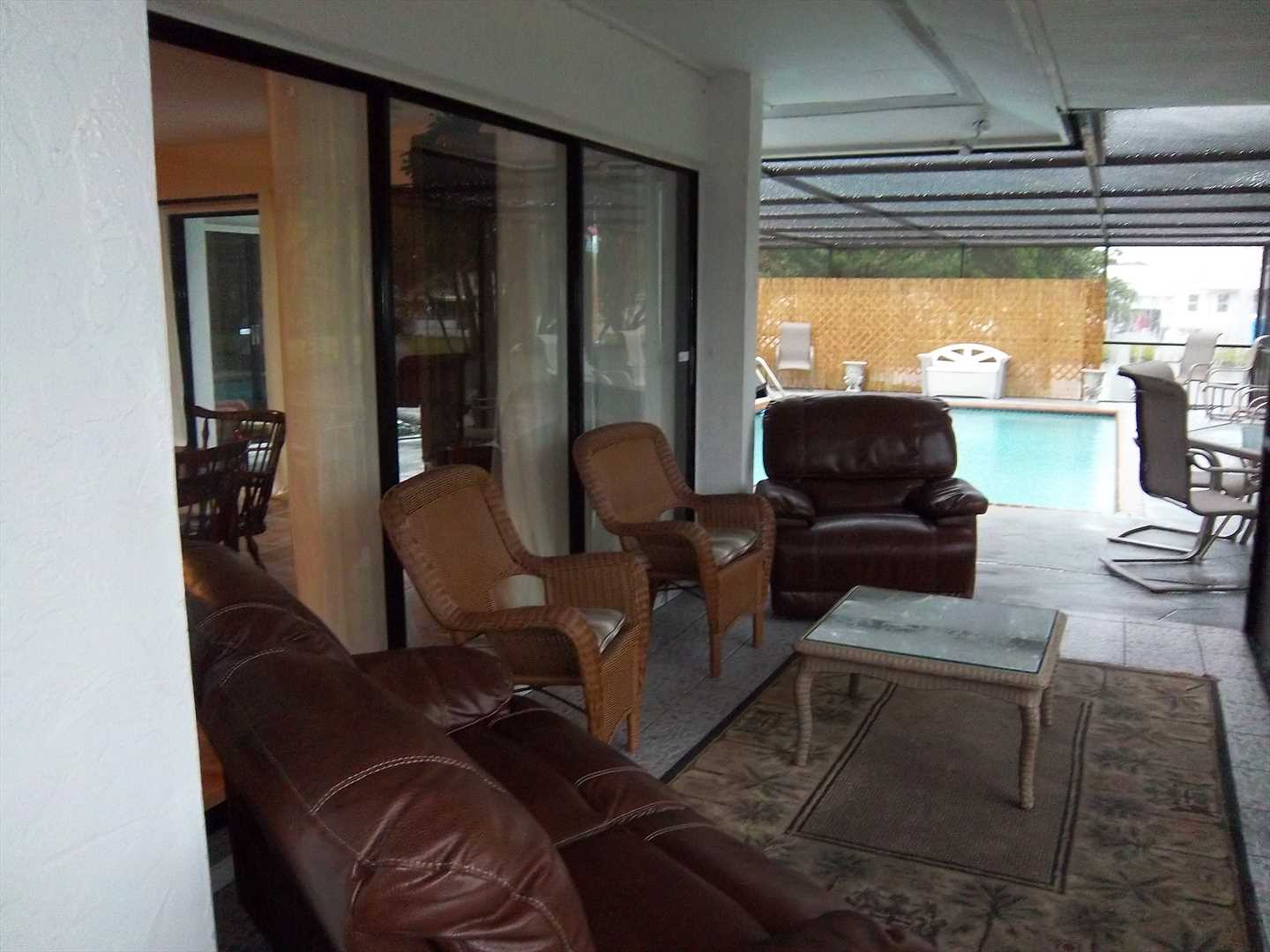 Laze in one of the leather recliners on the covered lanai wh